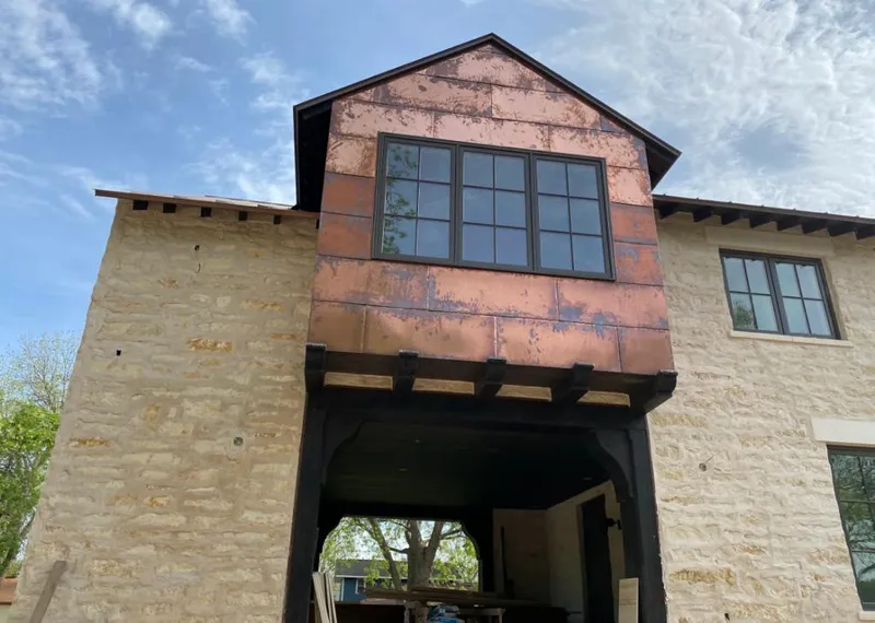 Copper metal panel facade on a stone building for Roof Repair in Jamesburg